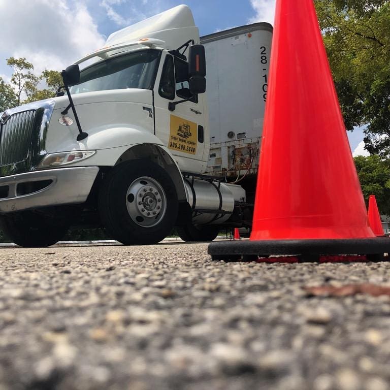semi truck with traffic cone